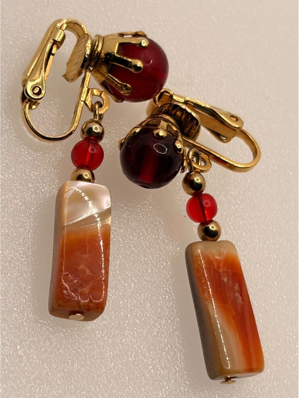 Red and brown dangle clip earrings